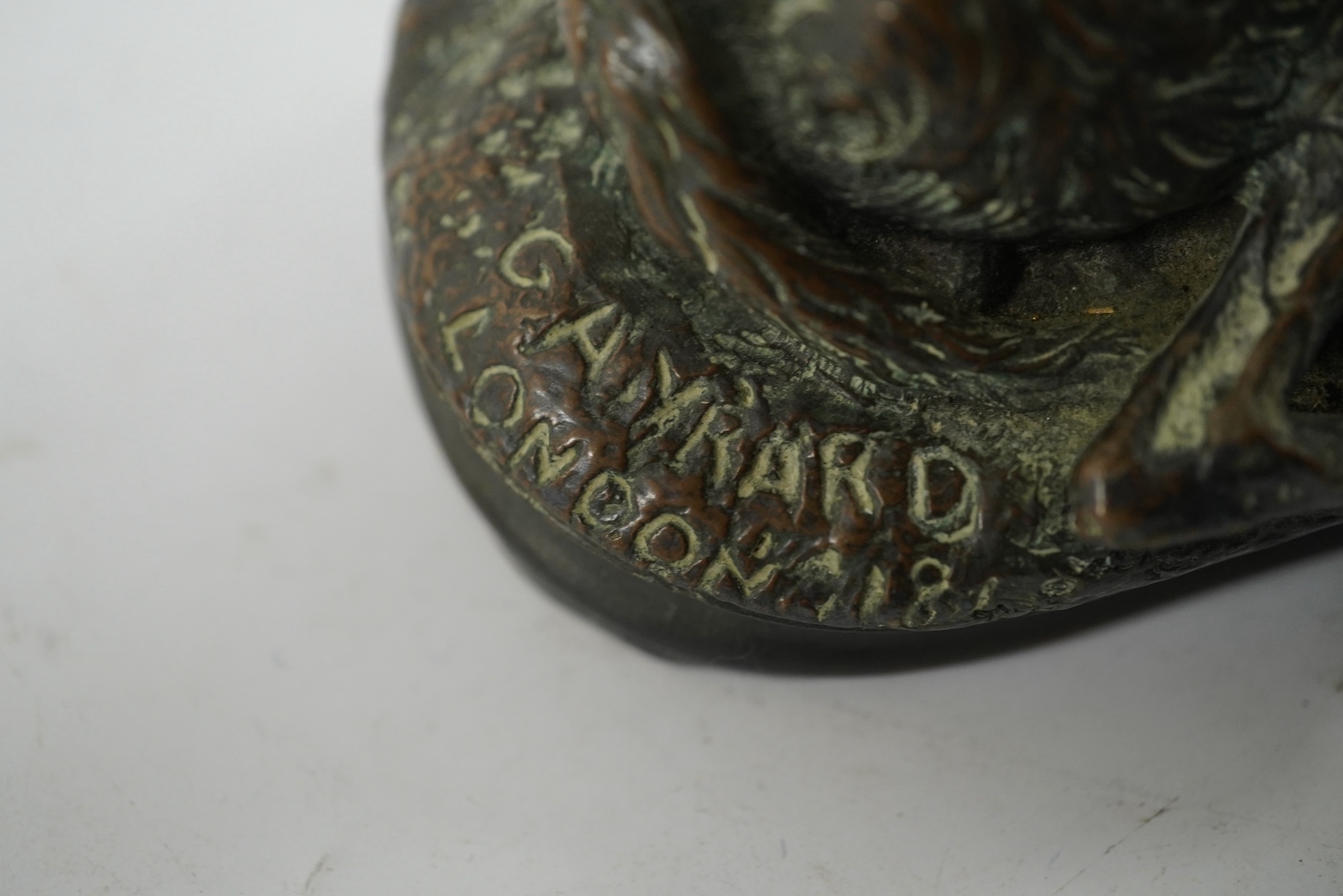 After Paul Joseph Raymond Gayrard (1807-1855), a small bronze of a deerhound in repose, 15cm wide. Condition - fair/good
